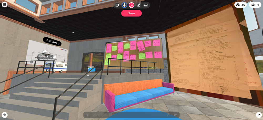 A digital space on Mozilla Hubs populated with notes and plans, a sofa and a flight of steps